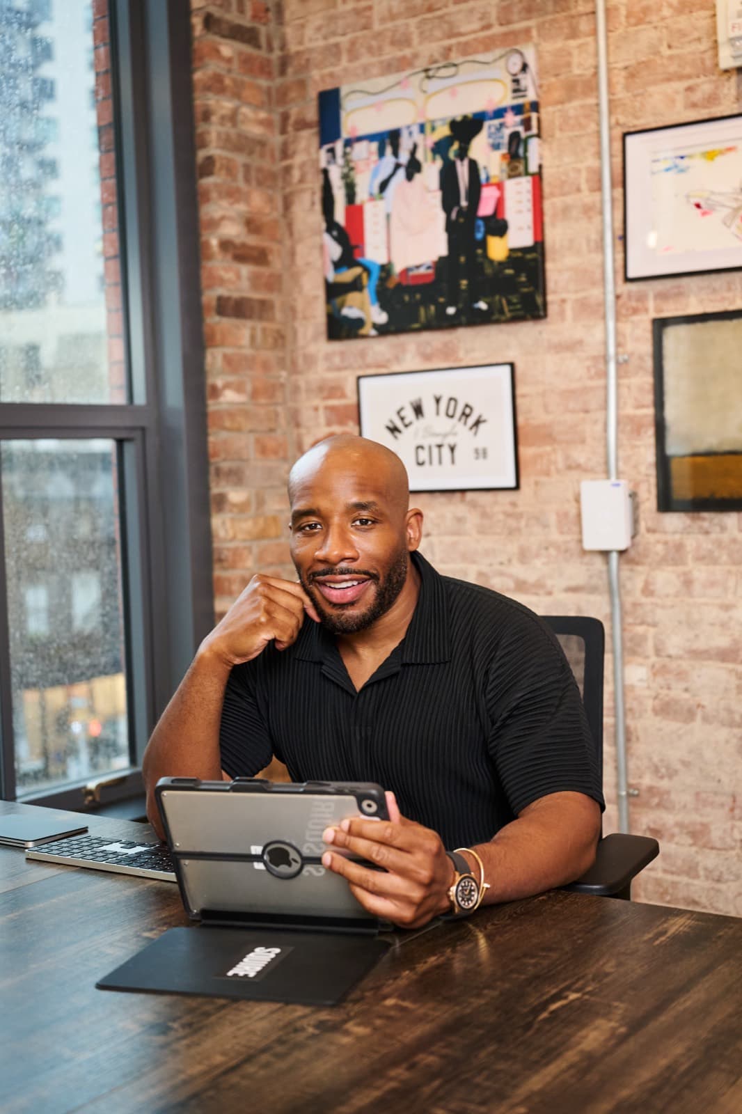 Dave Salvant at his desk in the Squire office in New York City